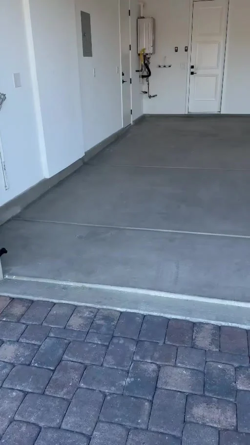 Garage concrete floor before the Resinart Finishes project
