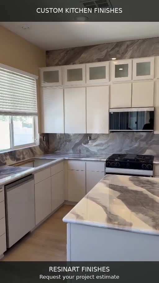 Actual Resinart Finishes kitchen project with gray and cream countertops, an island and a coordinated backsplash